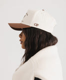 A woman wearing gigi-sports-vintage-trucker side view