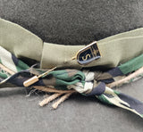 Camouflage band and branded hat pin