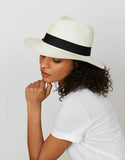Model wearing white straw fedora